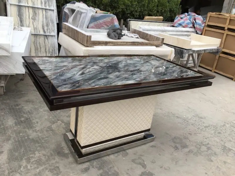 The Quilted Sovereign: Natural Marble & Eco-Leather Monolith Dining Table